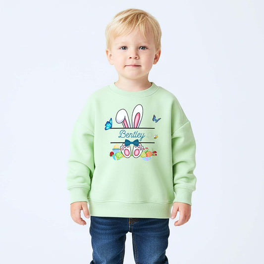 Boys Easter top with personalised split monogram bunny design, available as t-shirt or sweatshirt. Custom name Easter top