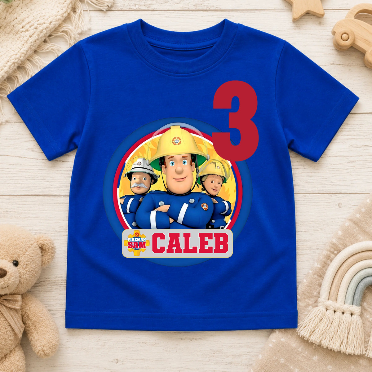 Personalised Fireman Sam birthday T-shirt for boys featuring a custom name and age with a colourful Fireman Sam-inspired design, perfect for birthday parties, cake smash photos and special celebrations.