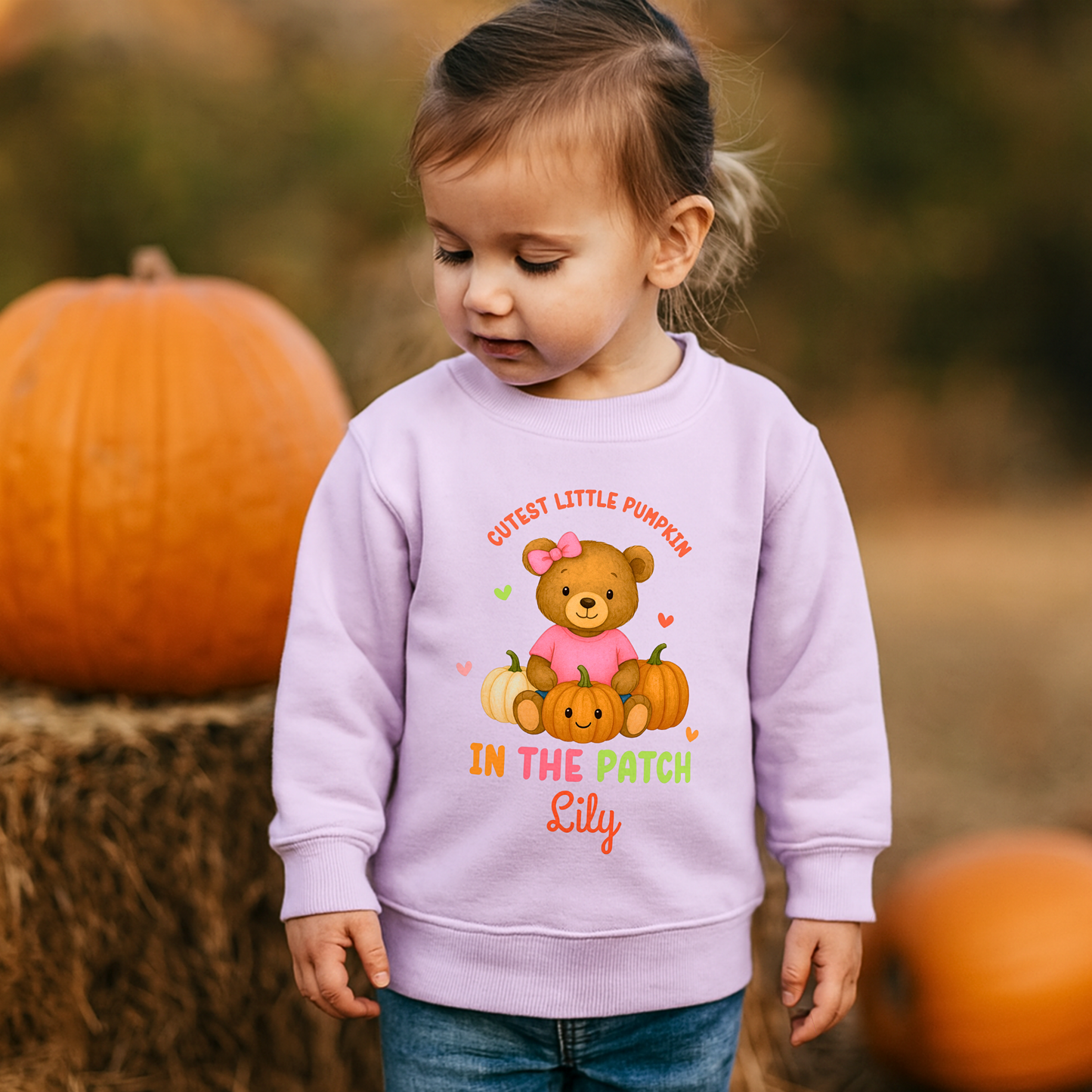 Personalised Halloween sweatshirt for kids with teddy bear and “Cutest Pumpkin in the Patch” design.