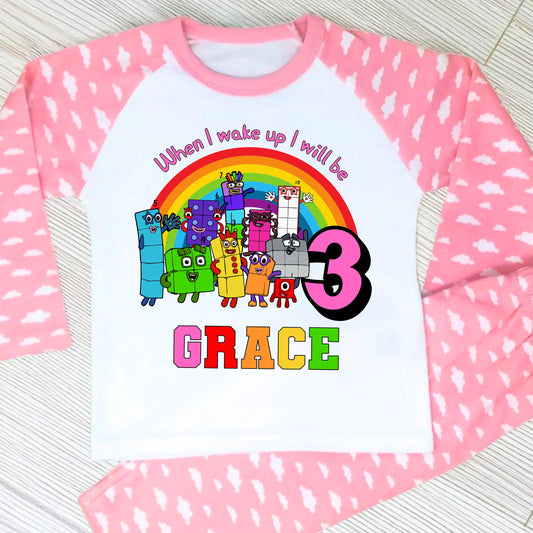 Numberblocks birthday pyjamas for girls personalised with name and age
Personalised girls birthday eve pyjamas featuring Numberblocks characters
Milestone birthday pyjama set with custom name and age