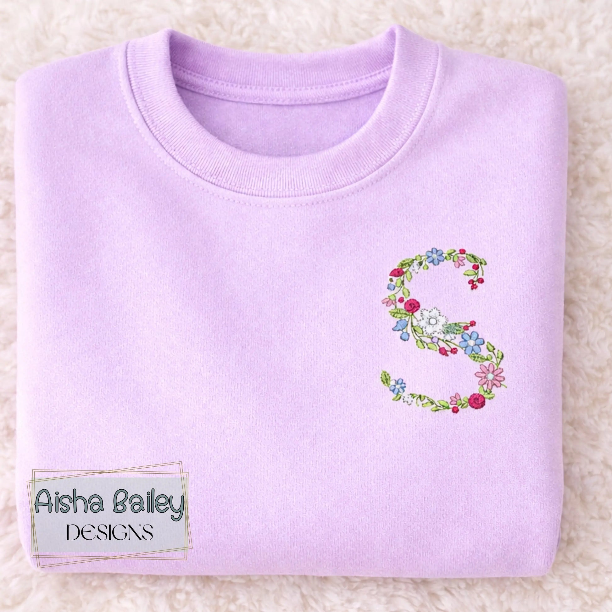 Floral initial embroidered sweatshirt: Floral initial girls sweatshirt featuring delicate embroidered flower letter design on soft kids jumper.