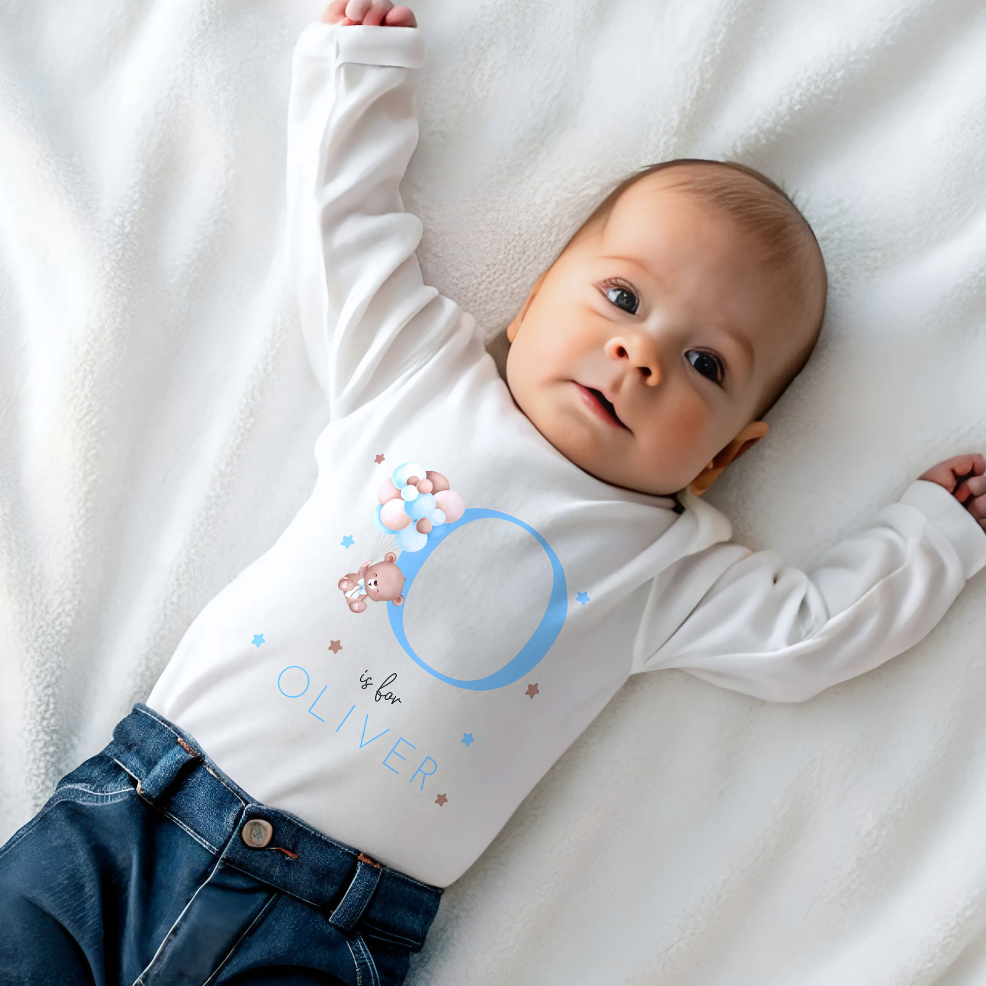personalised baby outfit: A personalised baby boy outfit featuring a blue balloon bear design with baby name initial. Available as a sleepsuit, bodysuit, T-shirt, or bib, this charming new baby gift is perfect for a coming home outfit or gender reveal celebration.
