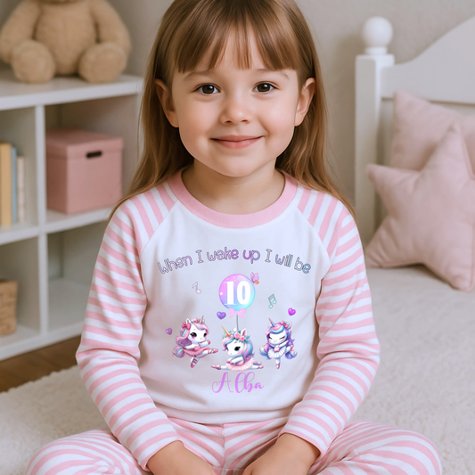 An adorable set of pastel pink and lilac birthday pyjamas, featuring a whimsical dancing unicorn design. Perfect for little girls who love unicorns, this personalised ‘When I Wake Up’ toddler set makes a magical gift for your little dancer. Personalised Birthday pyjamas, girls birthday gift, birthday outfit, unicorn present, personalised unicorn birthday ideas, uncicorn birthday party ideas