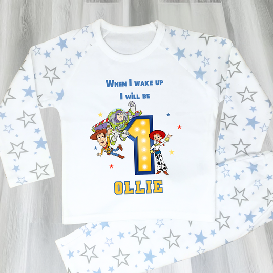 Toy Story birthday pyjamas for boys with custom name and age, featuring Buzz Lightyear, Woody, and Jessie, bold birthday number in Toy Story colours, and name printed underneath, soft and comfy sleepwear set for birthday mornings