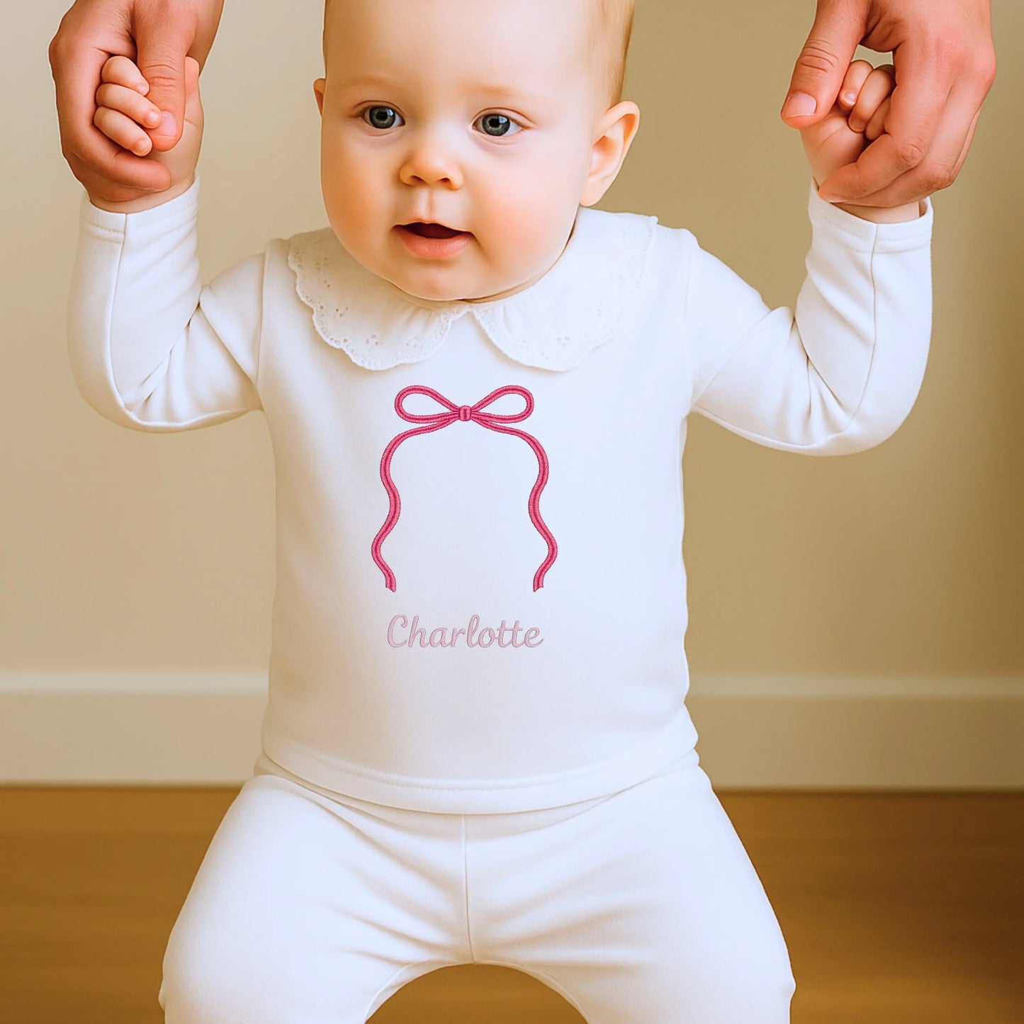 Personalised bow pyjamas for girls with embroidered bow and name on soft white sleepwear