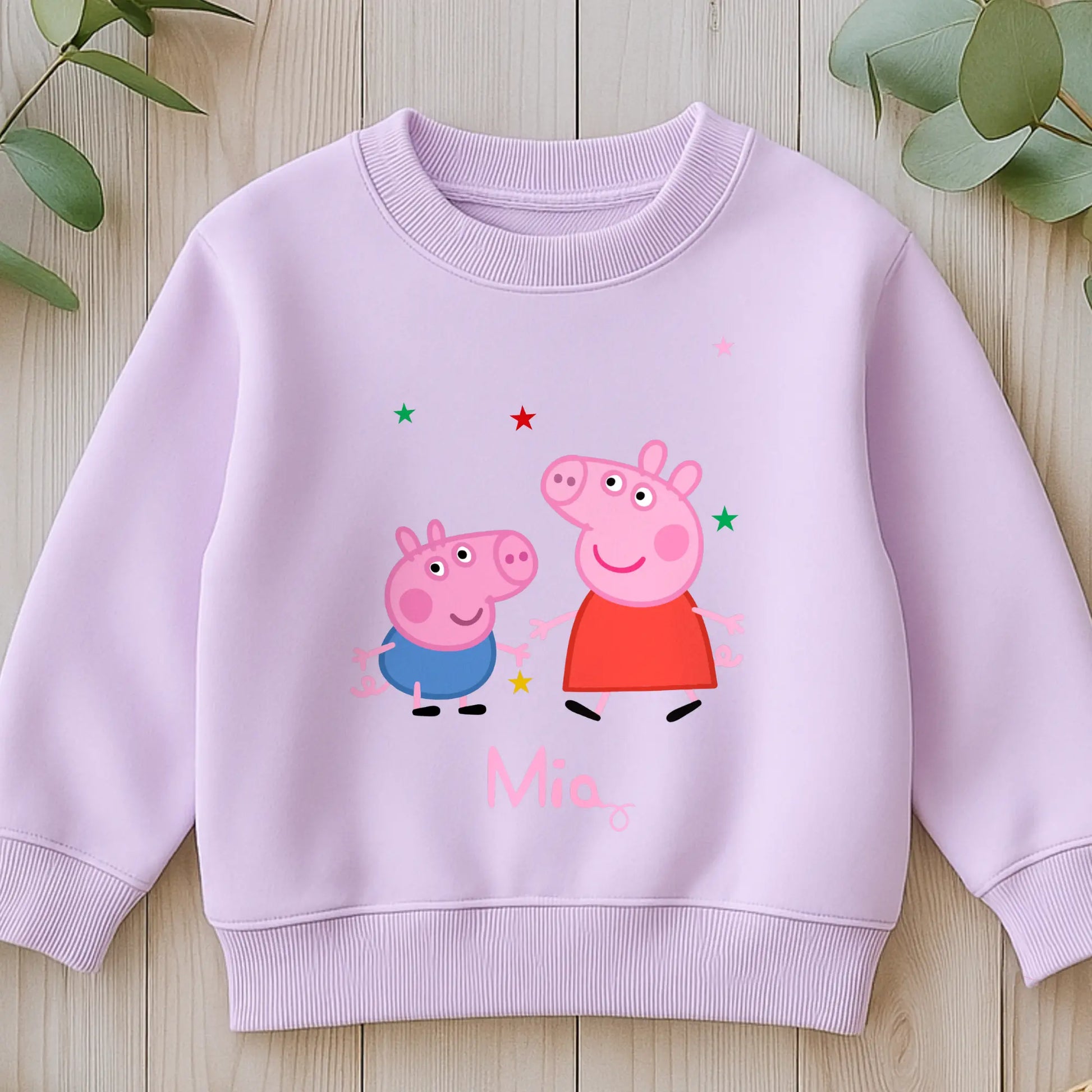 Personalised Peppa and George Sweatshirt: Child wearing a personalised Peppa and George Pig white sweatshirt with her custom name printed on it.