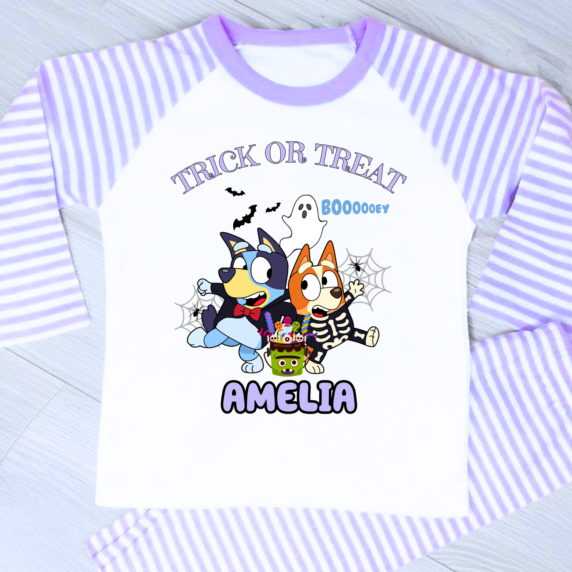 Girls personalised Bluey and Bingo Halloween pyjamas with name print and cute spooky design