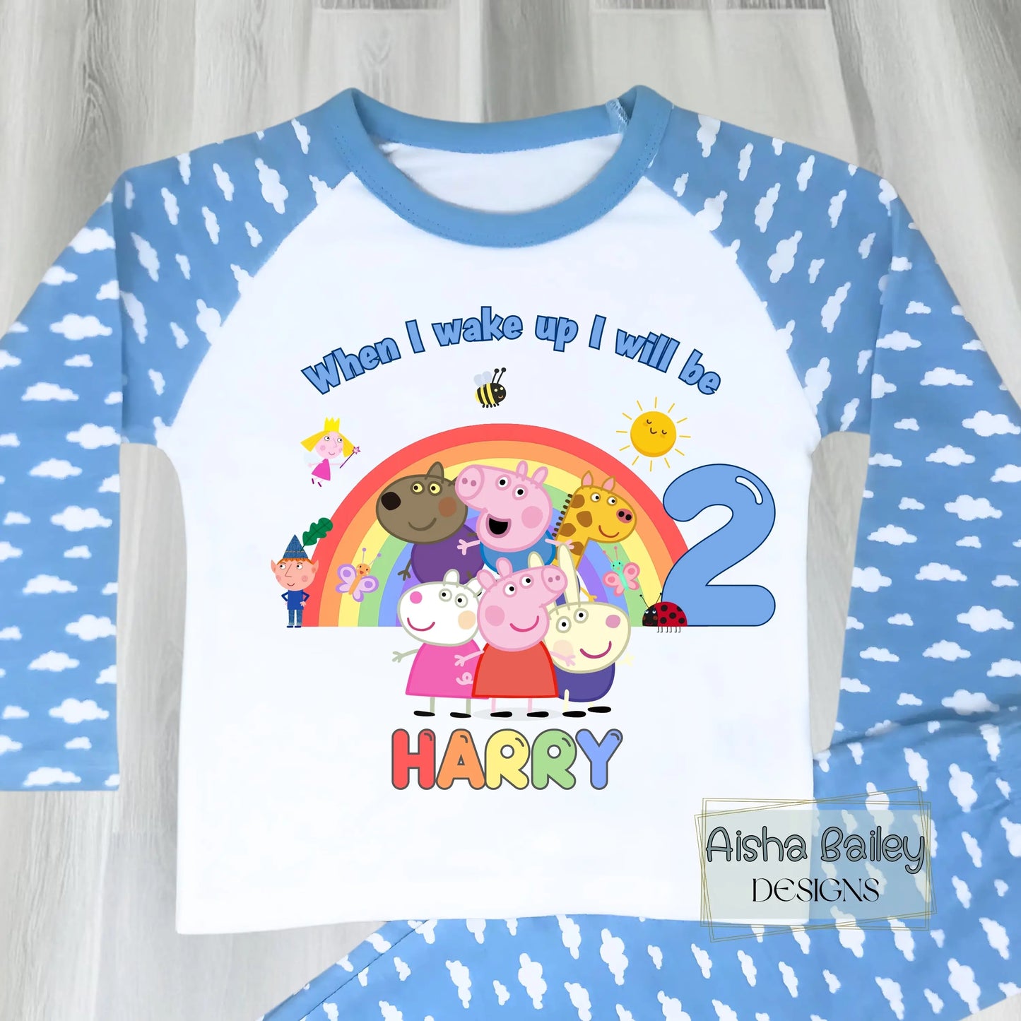 Blue Peppa Pig and friends personalised girls birthday pyjamas featuring a rainbow design and the text “When I wake up I will be with custom age and name, printed on a soft long-sleeve top and matching pink bottoms. Perfect personalised Peppa Pig birthday outfit for toddlers, ideal for first second third birthday celebrations, gifts, and bedtime photos.