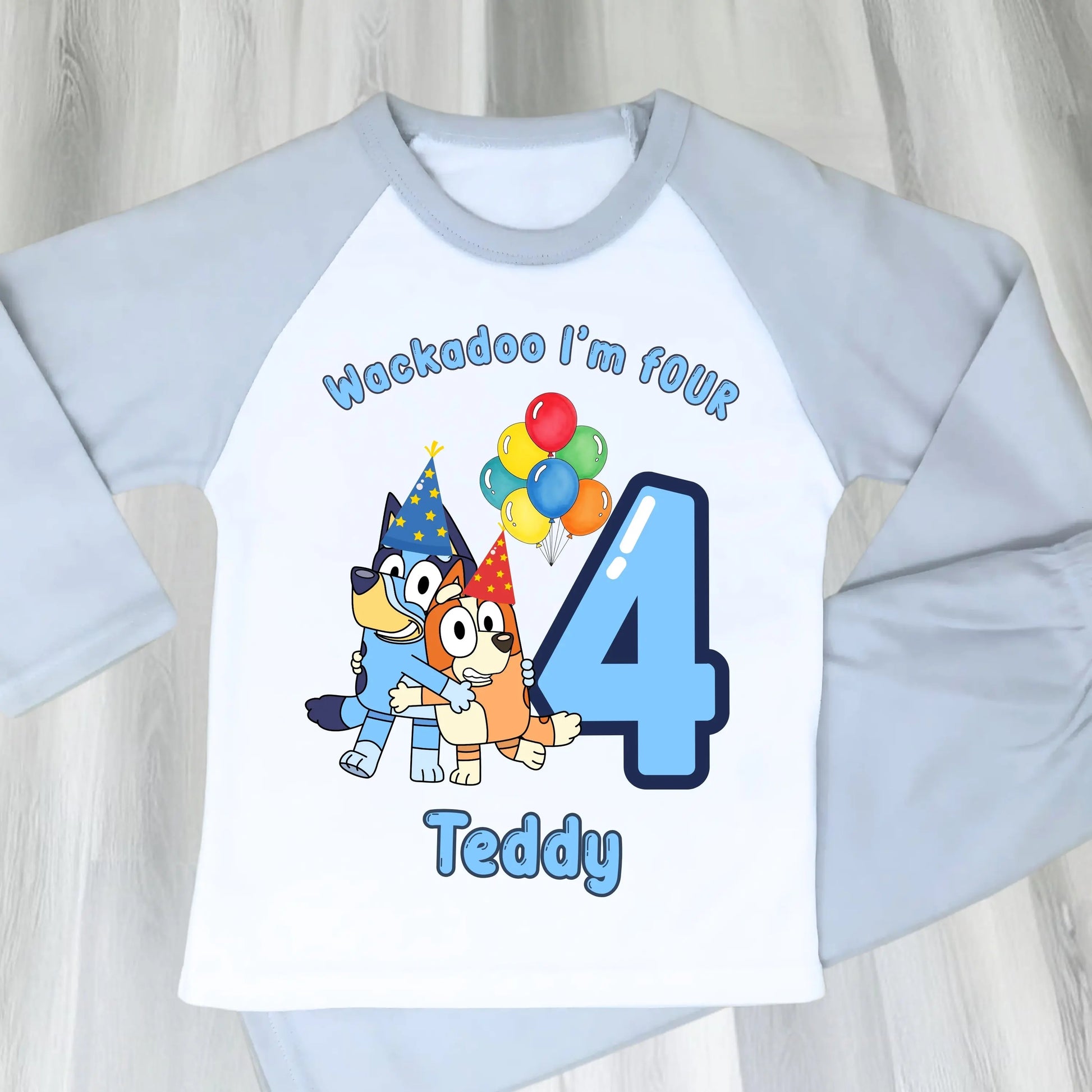 Bluey and Bingo Birthday Pyjamas for Boys with custom name and age in a blue party-themed design.
