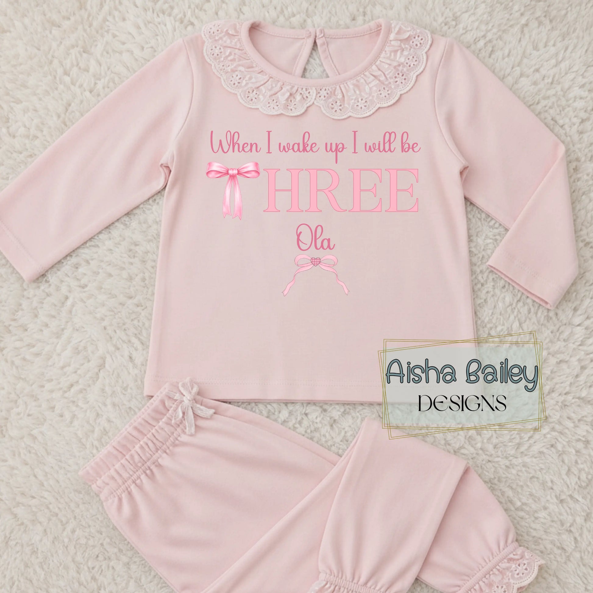 pink girls birthday pyjamas with pink bow and frilly collar