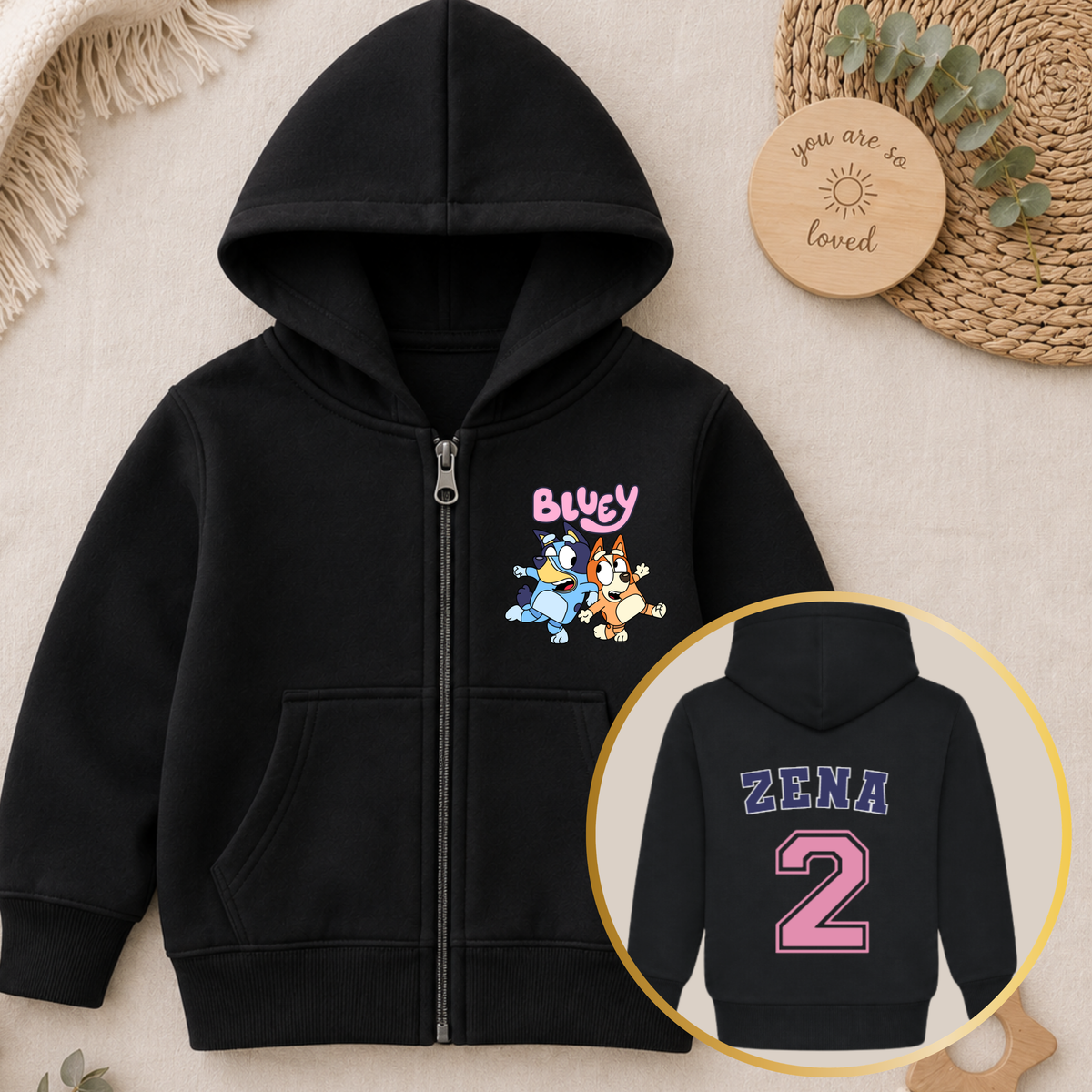 Personalised Girls Birthday Hoodie featuring Bluey and Bingo on the front, with your child's name and birthday age in a pink varsity-style design on the back.