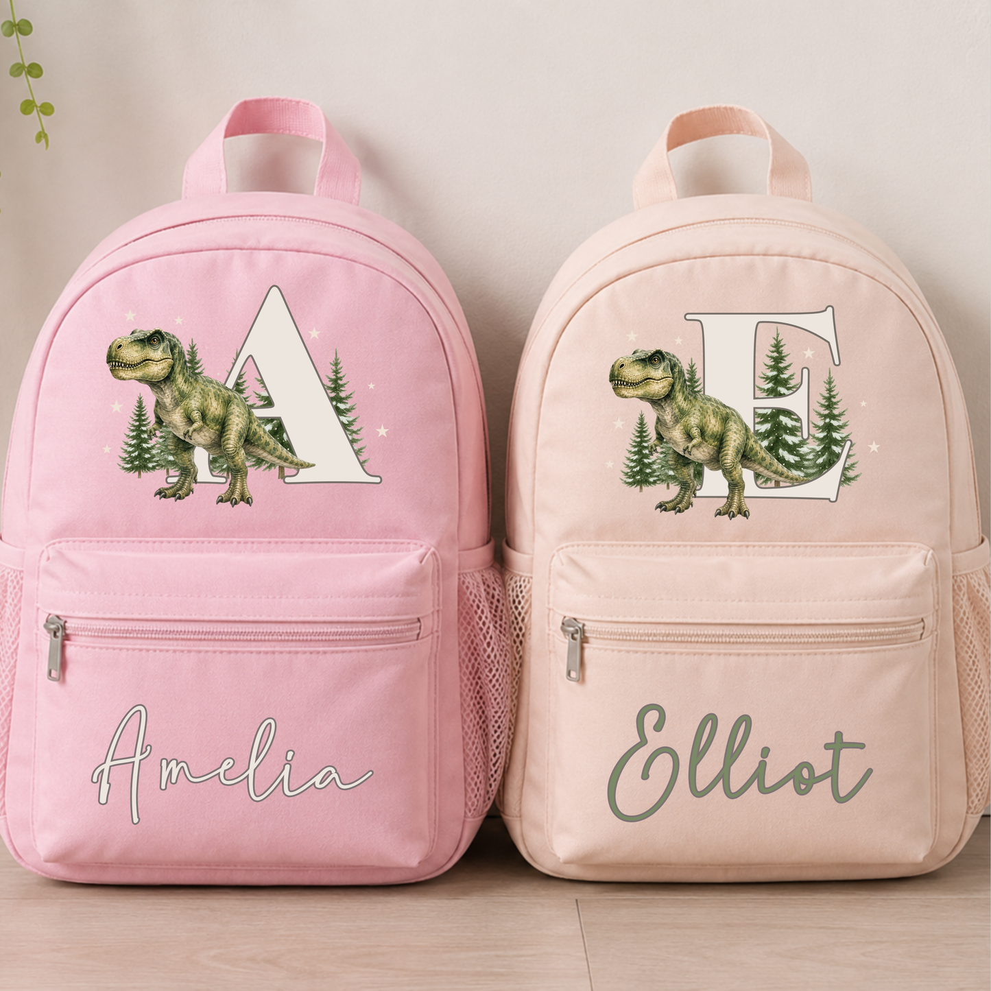 Personalised dinosaur backpack for boys with realistic watercolour T-Rex, woodland initial and custom name on sage, beige and blue school rucksack.