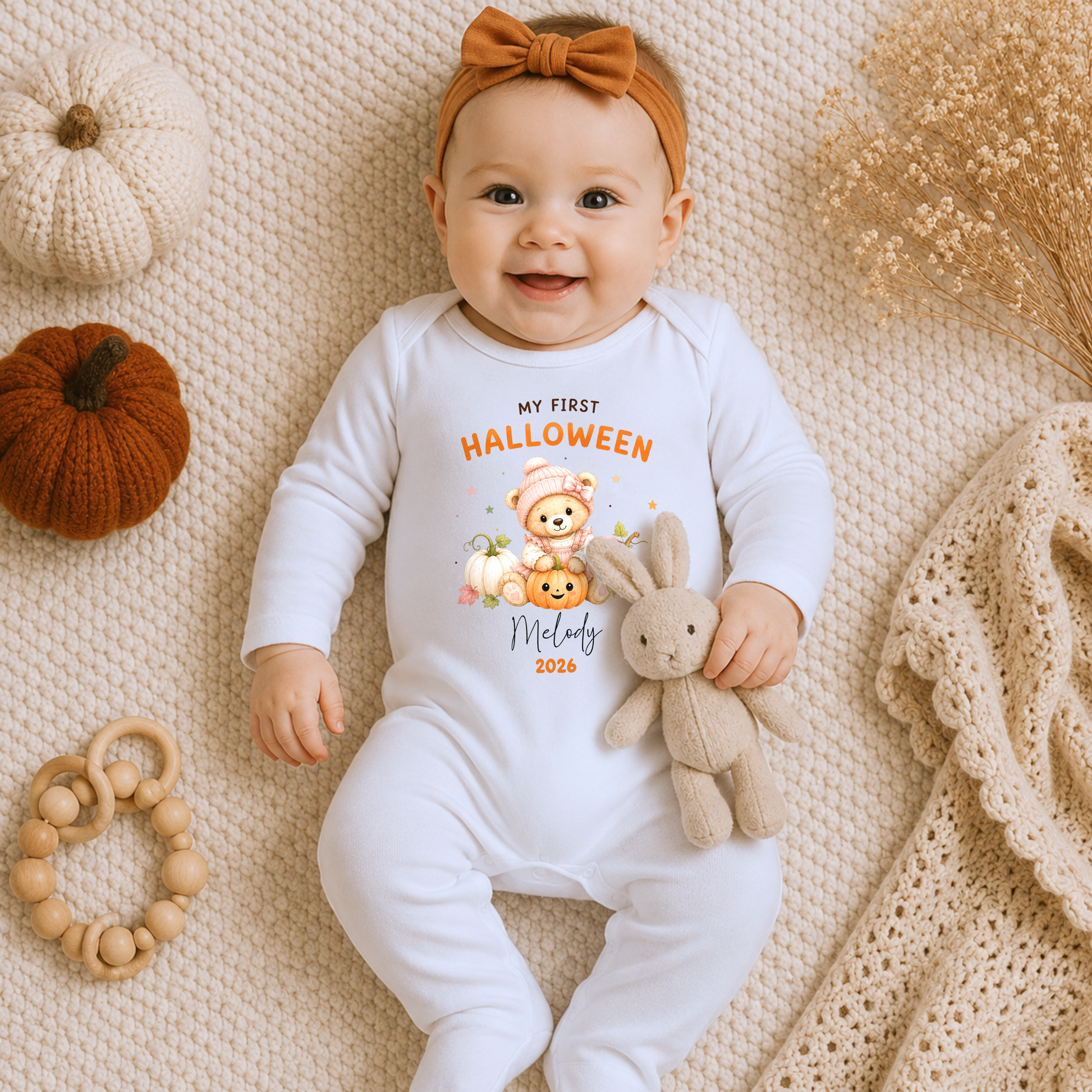 Personalised First Halloween Baby Outfit with cute teddy bear and pumpkins, customised with baby's name and year for their first Halloween.