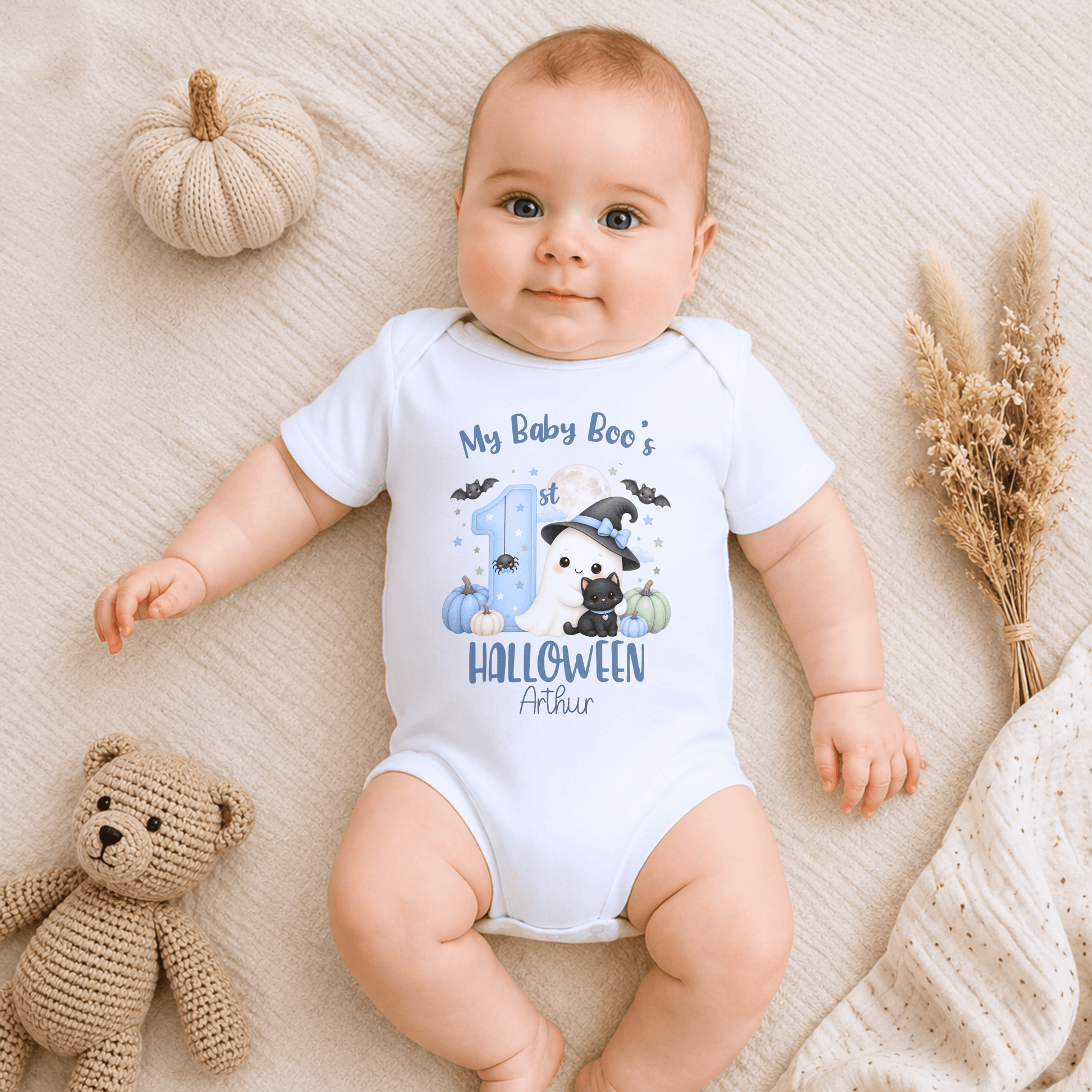 Personalised First Halloween Baby Outfit for boys featuring a cute Baby Boo ghost, black cat, pumpkins, bats and personalised 1st Halloween design.