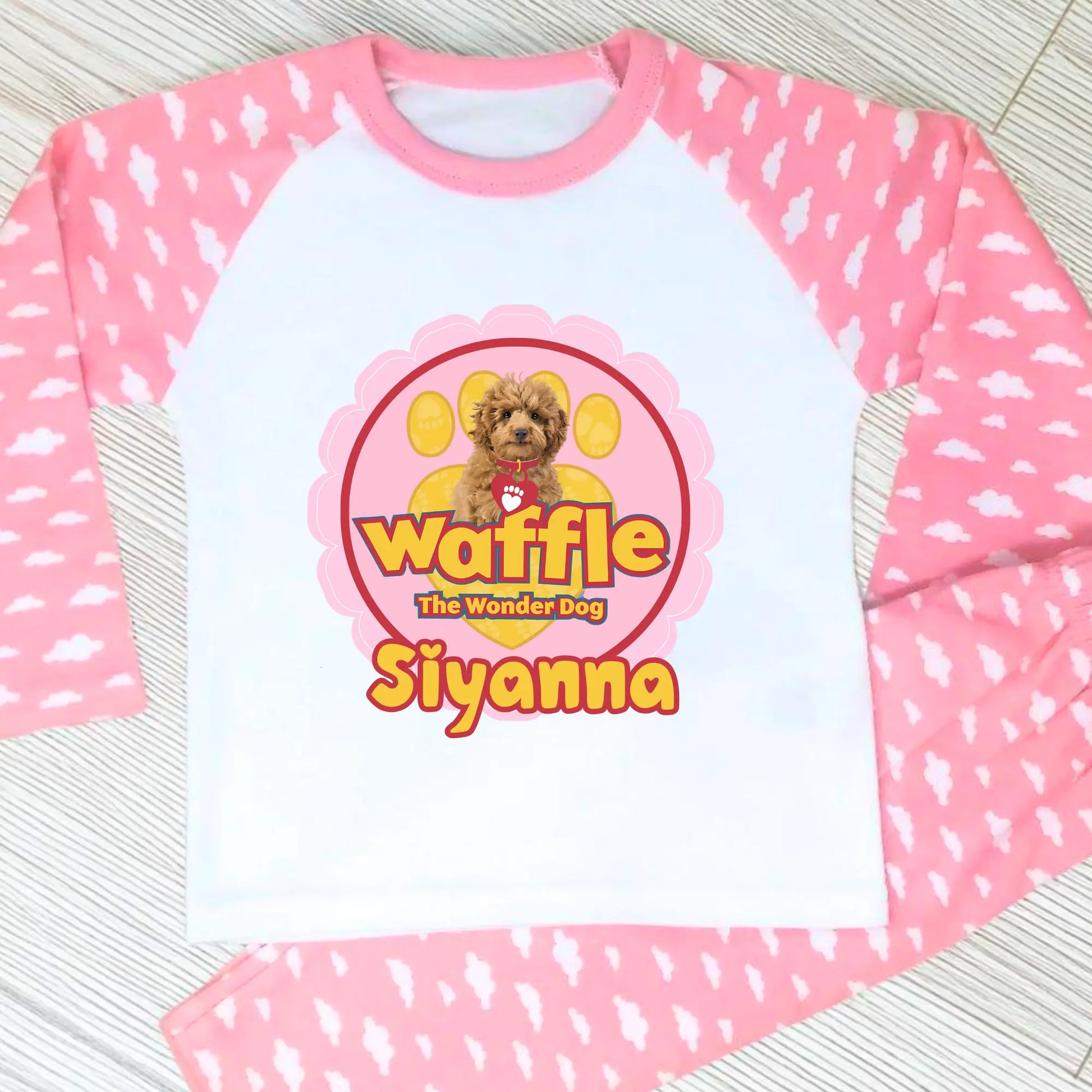 Personalised Waffle Pyjamas: Children's long-sleeve pyjamas with personalised Waffle the Wonder Dog design on a star-patterned background, custom name pyjamas