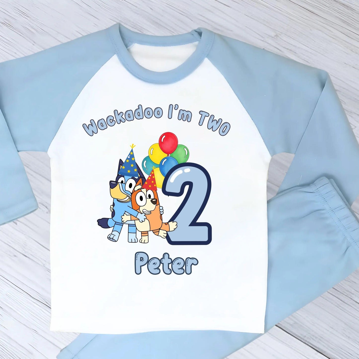 Bluey and Bingo Birthday Pyjamas for Boys with custom name and age in a blue party-themed design.