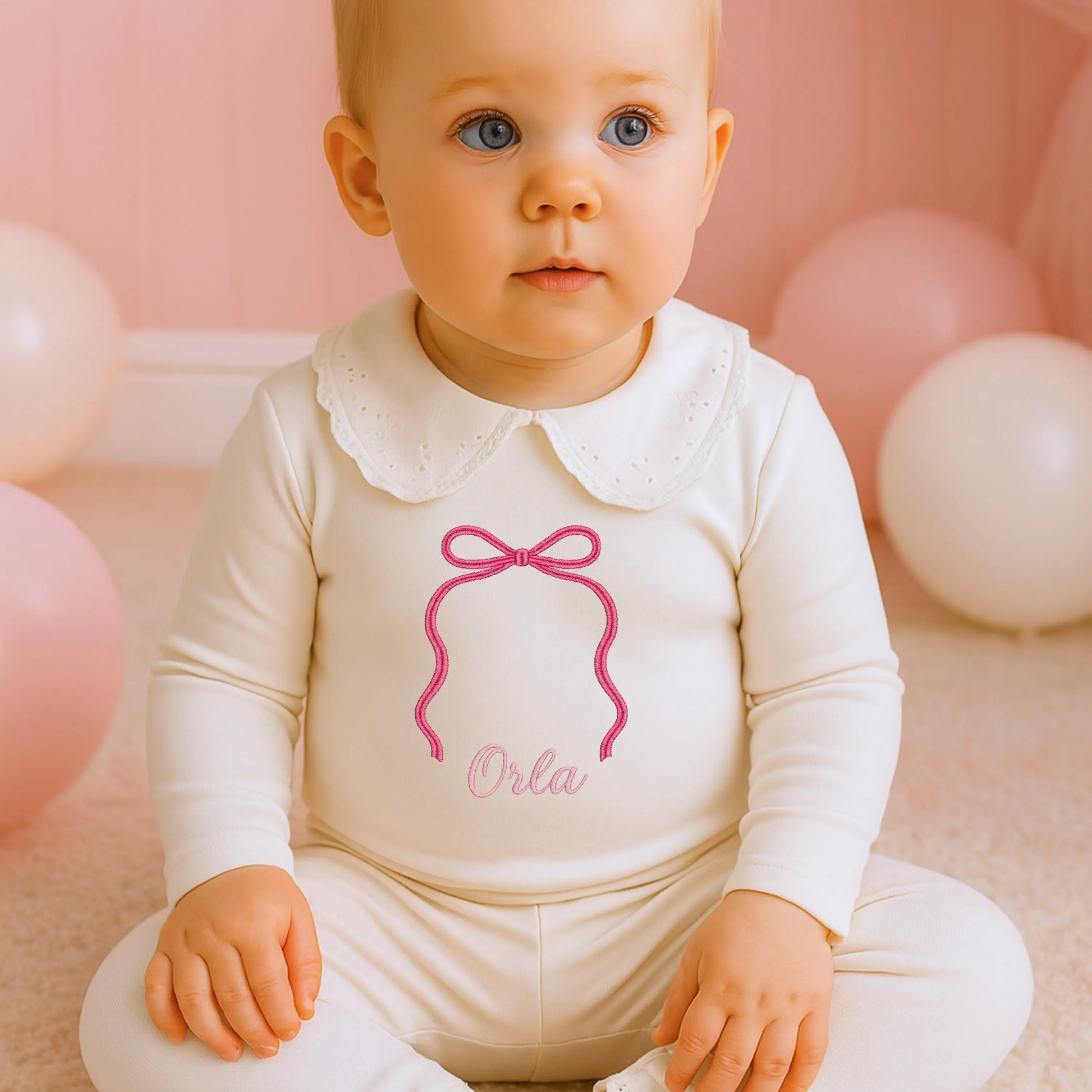 Personalised bow pyjamas for girls with embroidered bow and name on soft white sleepwear