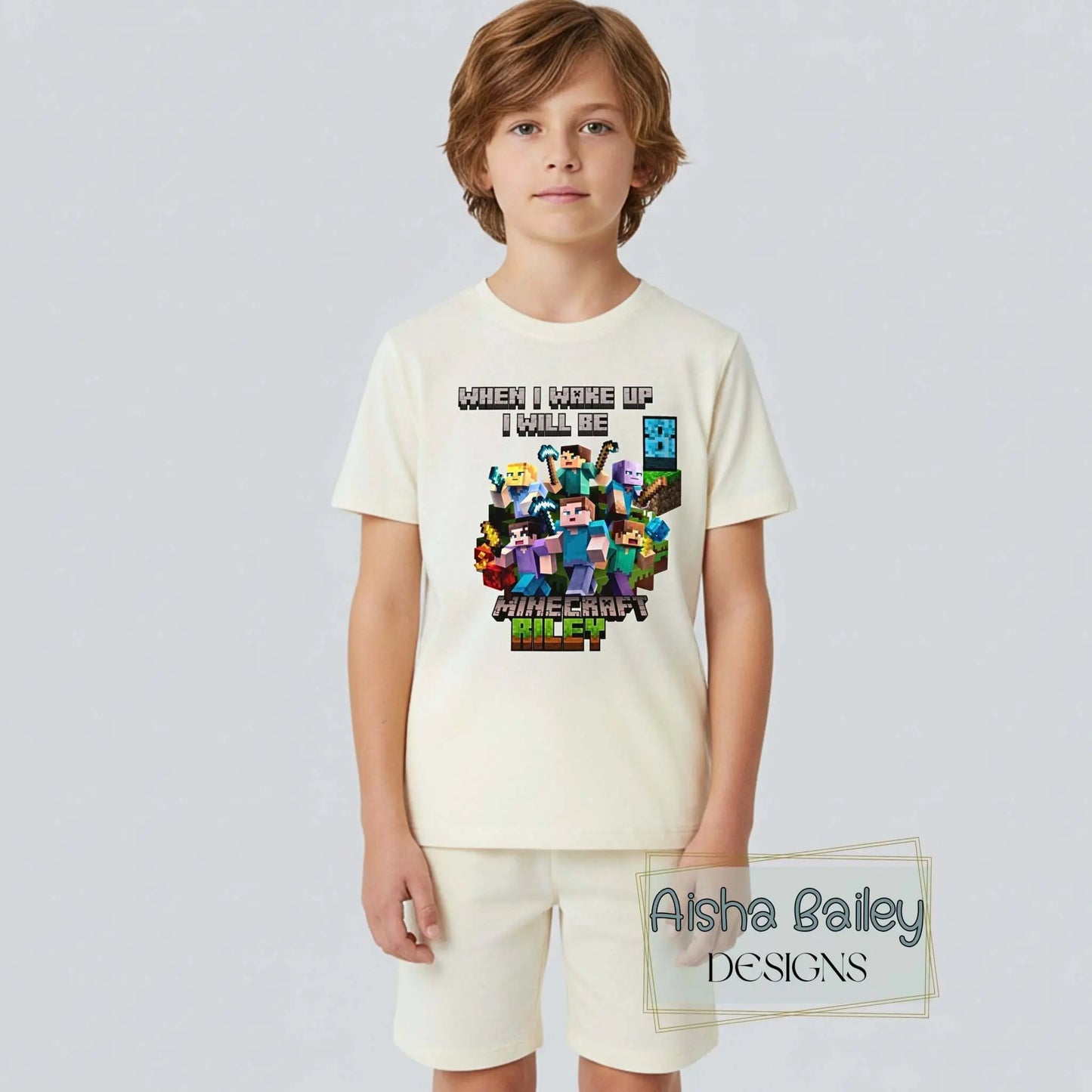Minecraft Birthday Pyjama Shorts, Boy wearing personalised Minecraft birthday pyjamas with custom age on white t-shirt and matching shorts in a bright modern bedroom setting