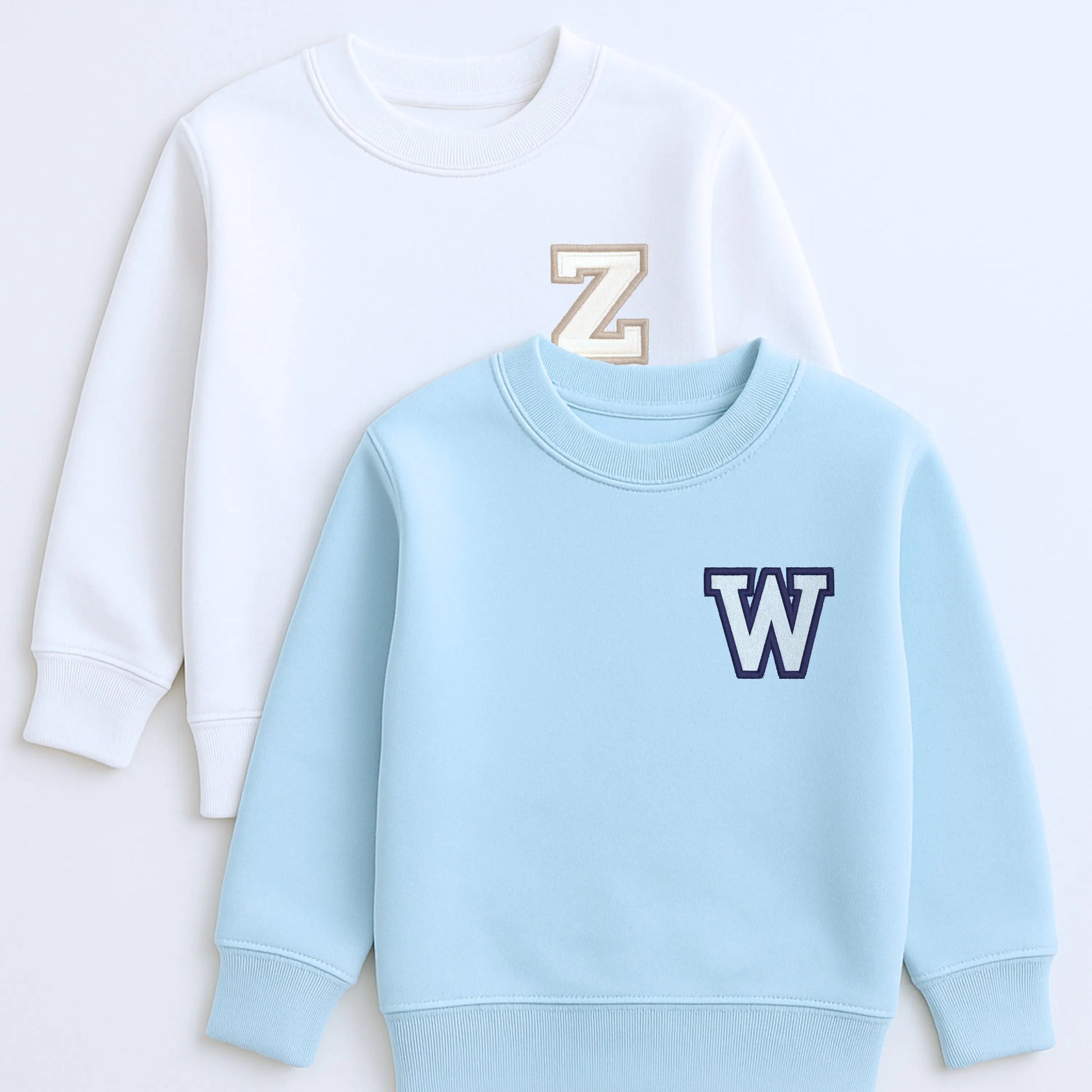 Varsity Initial Embroidered Sweatshirt: Light blue sweatshirt with an embroidered letter 'W' initial on a white background