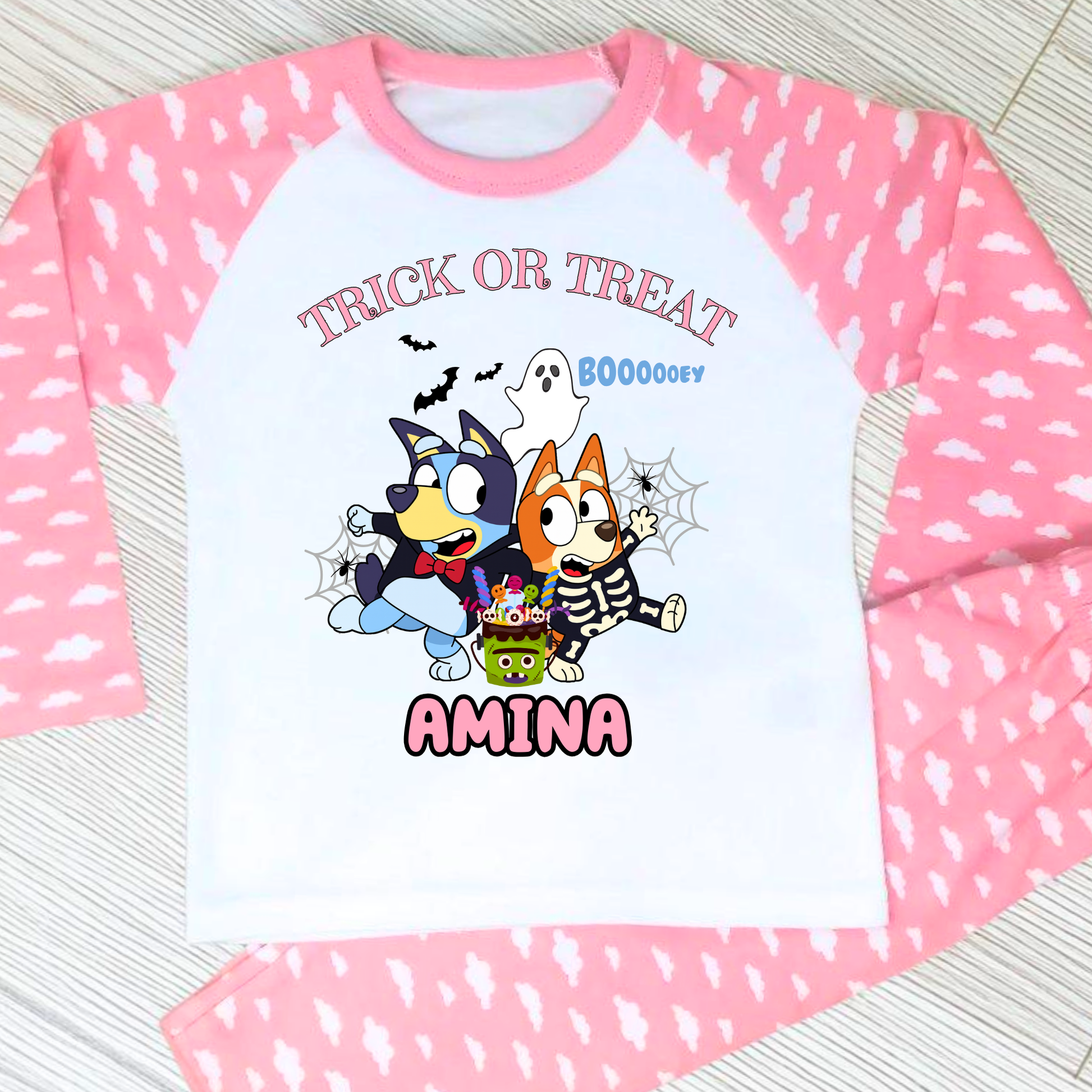 Girls personalised Bluey and Bingo Halloween pyjamas with name print and cute spooky design