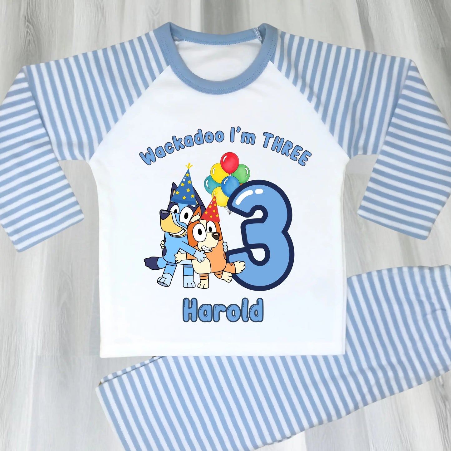 Bluey and Bingo Birthday Pyjamas for Boys with custom name and age in a blue party-themed design.