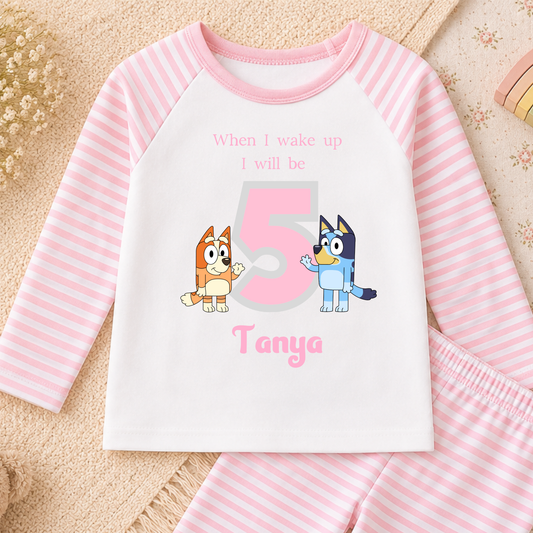 Girls Personalised Bluey Birthday Pyjamas with Bluey and Bingo, customised with child's name and birthday age for a special birthday celebration.