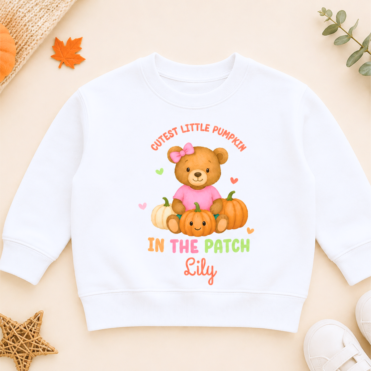 Girls Personalised Halloween Sweatshirt with cute teddy bear, pumpkins, Cutest Pumpkin in the Patch design and child's personalised name.