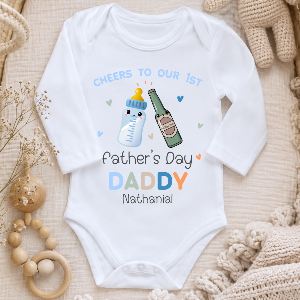 1st Father’s Day Outfit featuring a cute Daddy and Baby drinks toast design, available as a baby sleepsuit, vest, T-shirt or bib.