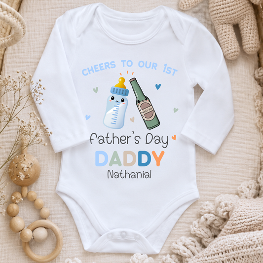 1st Father’s Day Outfit featuring a cute Daddy and Baby drinks toast design, available as a baby sleepsuit, vest, T-shirt or bib.